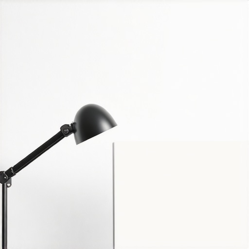 A desk lamp facing a wall to create ambient backlighting for a computer monitor setup.